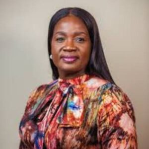 Dr Tomi Coker